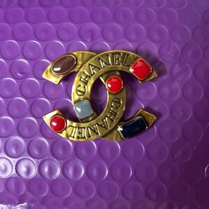 CHANEL Gold Brooch with Red and Blue Accents